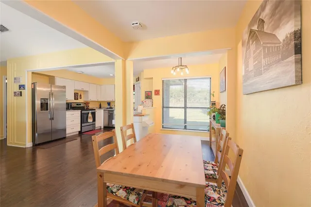 a open kitchen with a table and chairs