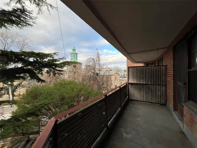 a view of balcony with furniture