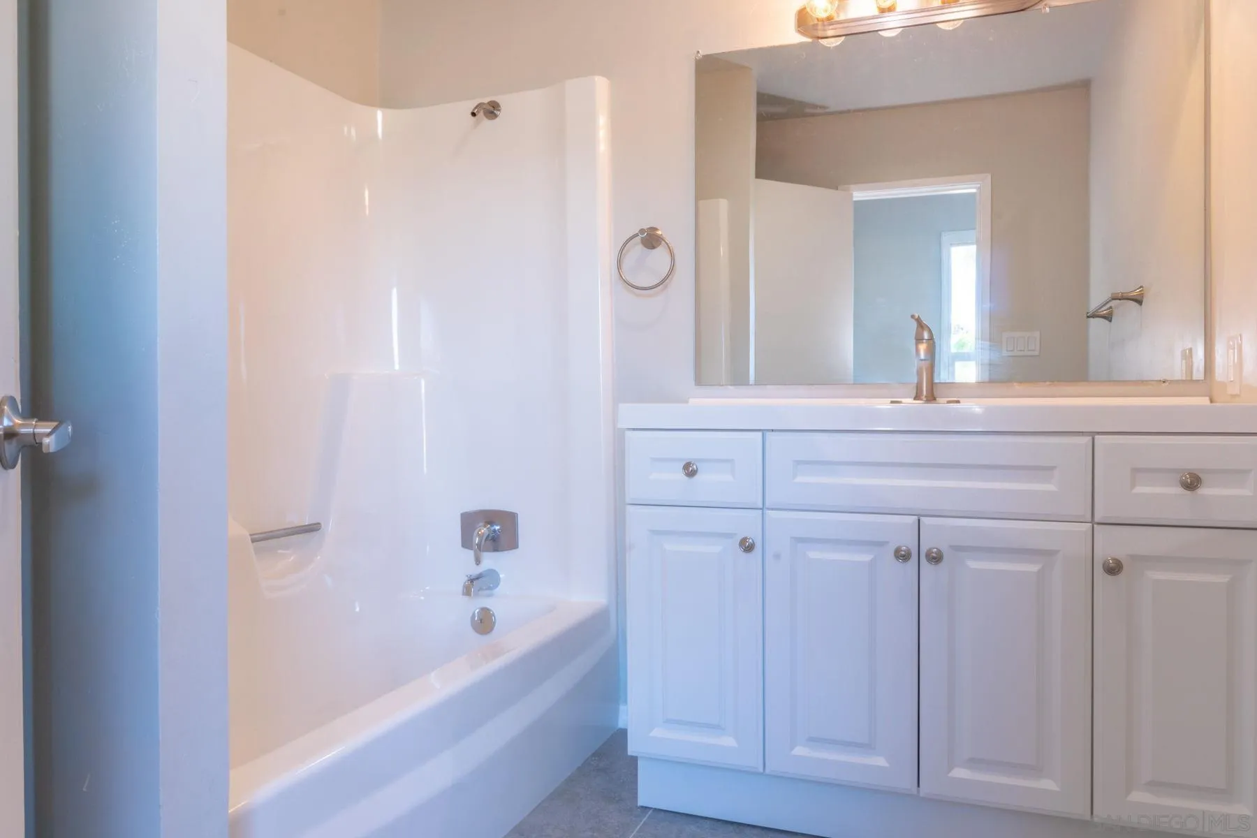 3862 Spring Drive Spring Valley, CA 91977 - Photo 11 of 18 a bathroom with a bathtub and a sink