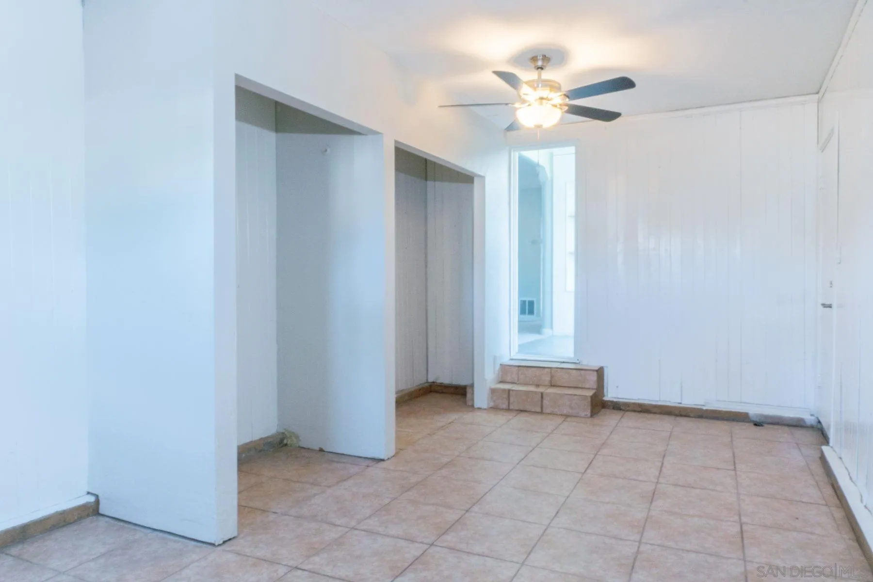 3862 Spring Drive Spring Valley, CA 91977 - Photo 15 of 18 an empty room with windows and ceiling fan