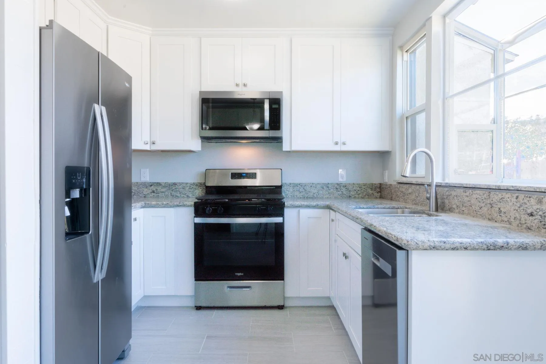 3862 Spring Drive Spring Valley, CA 91977 - Photo 6 of 18 a kitchen with stainless steel appliances granite countertop a refrigerator stove and microwave