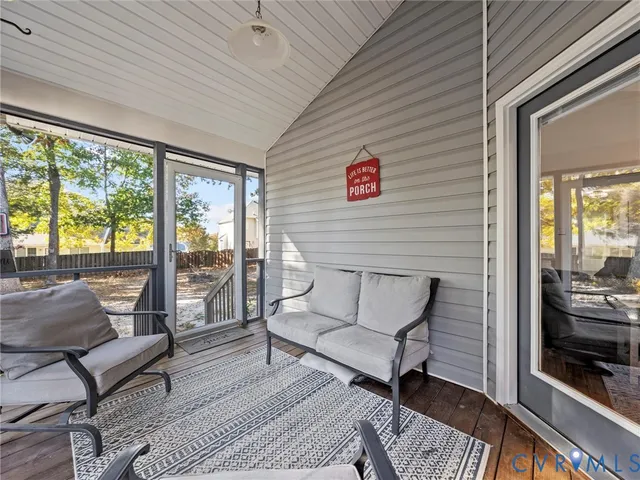 a view of a two chairs in the balcony