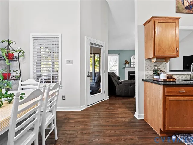 a kitchen with granite countertop a stove and a refrigerator
