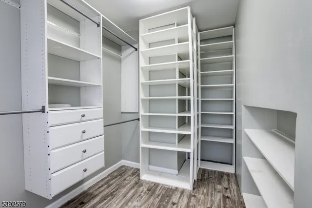 a view of a dresser with window in the background