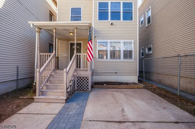 a view of front door of house with stairs