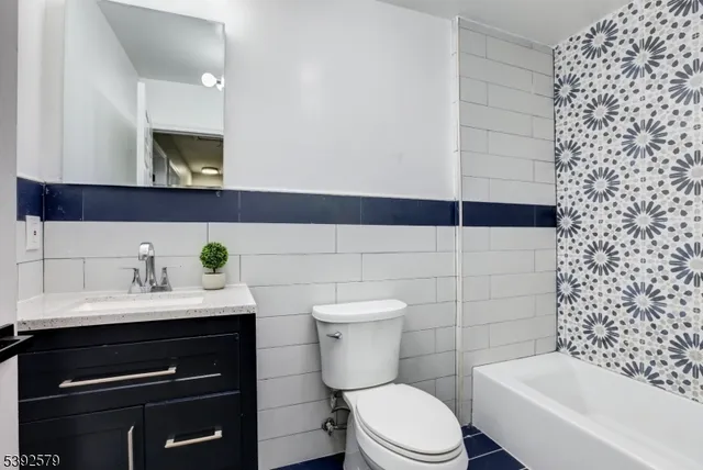 a bathroom with a toilet and a bathtub