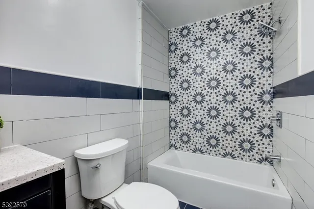 a view of a hallway with washer and dryer