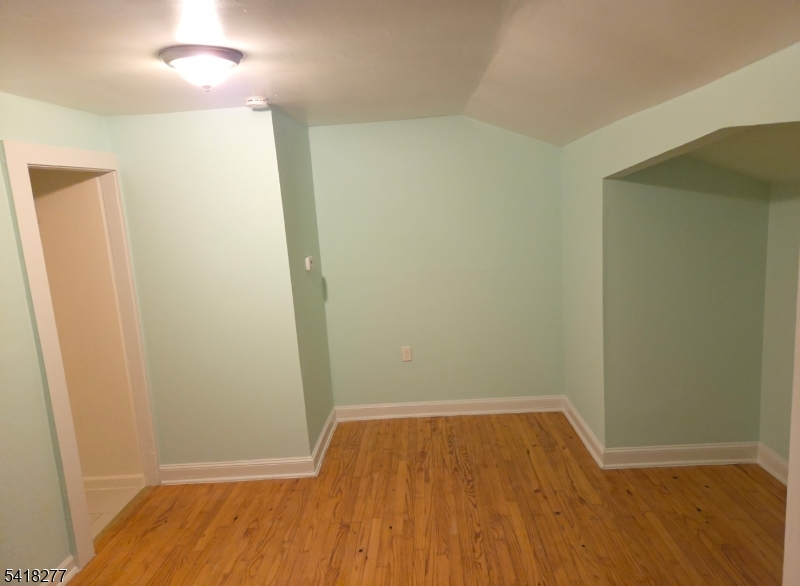117 Ridgedale Avenue Cedar Knolls, NJ 07927 - Photo 2 of 6 an empty room with wooden floor and closet
