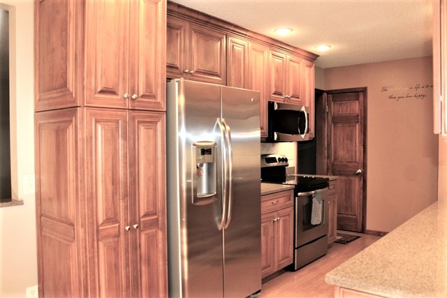 15890 Bishop Road Morrison, IL 61270 - Photo 11 of 34 a kitchen with stainless steel appliances granite countertop a refrigerator and a stove top oven