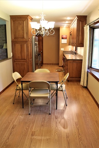 15890 Bishop Road Morrison, IL 61270 - Photo 14 of 34 a view of a dining room with furniture and wooden floor