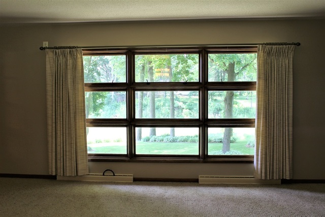 15890 Bishop Road Morrison, IL 61270 - Photo 17 of 34 a view of room with window and floor to ceiling window