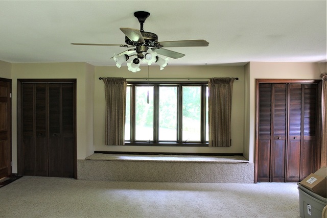 15890 Bishop Road Morrison, IL 61270 - Photo 19 of 34 a view of a livingroom with a ceiling fan and window