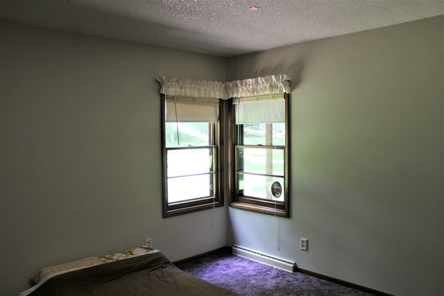 15890 Bishop Road Morrison, IL 61270 - Photo 25 of 34 an empty room with a window