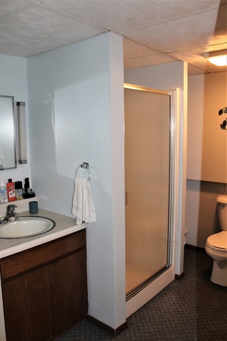 15890 Bishop Road Morrison, IL 61270 - Photo 27 of 34 a bathroom with a sink a toilet and mirror