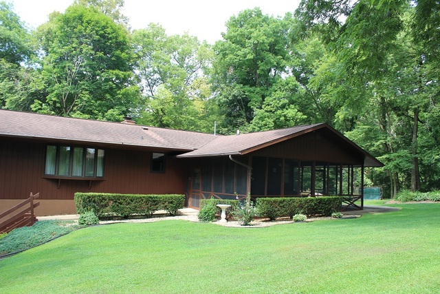 15890 Bishop Road Morrison, IL 61270 - Photo 5 of 34 a view of a house with a yard plants and large tree