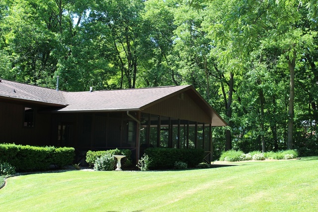 15890 Bishop Road Morrison, IL 61270 - Photo 6 of 34 a house that has a tree in it