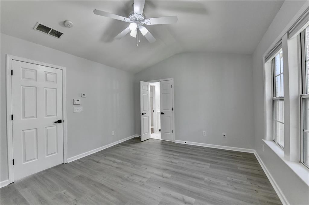 3977 Howell Park Road Duluth, GA 30096 - Photo 17 of 25 wooden floor in an empty room with a window