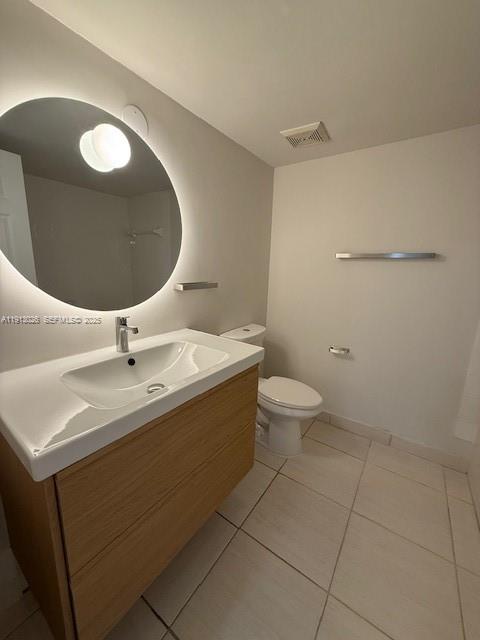 12136 St.Andrews Place, Unit 204 Miramar, FL 33025 - Photo 11 of 21 a bathroom with a sink mirror and toilet