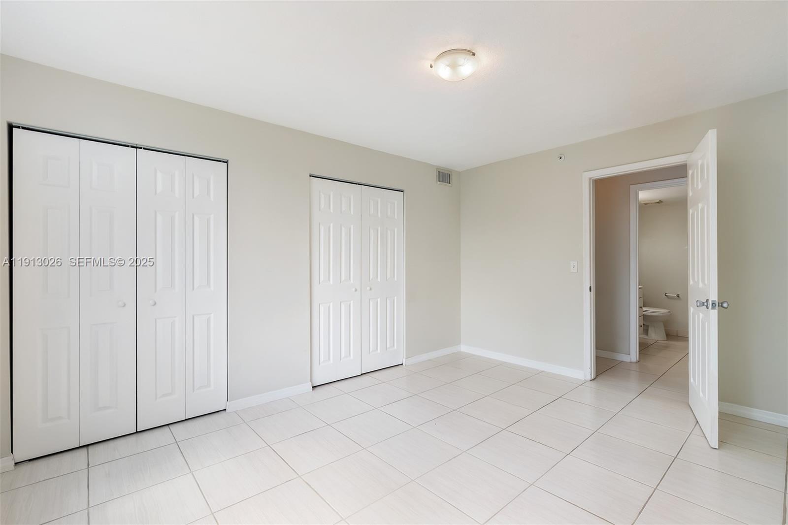 12136 St.Andrews Place, Unit 204 Miramar, FL 33025 - Photo 12 of 21 a view of an empty room and closet area