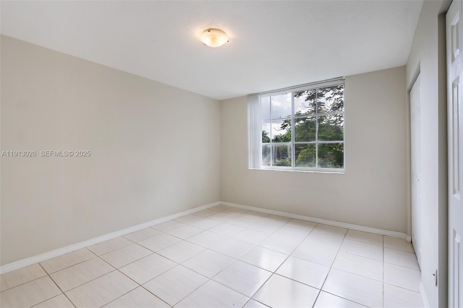 12136 St.Andrews Place, Unit 204 Miramar, FL 33025 - Photo 16 of 21 an empty room with windows