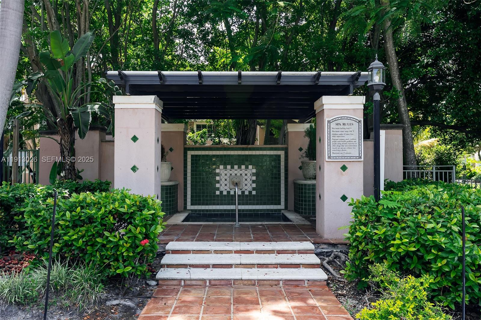 12136 St.Andrews Place, Unit 204 Miramar, FL 33025 - Photo 19 of 21 a front view of a house with a garden