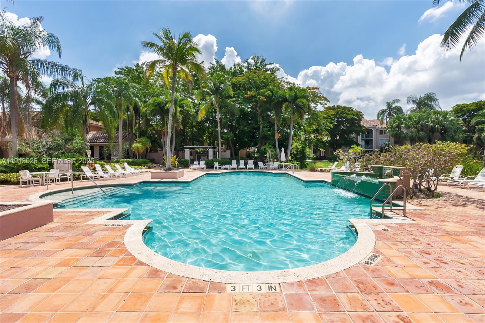 12136 St.Andrews Place, Unit 204 Miramar, FL 33025 - Photo 20 of 21 a view of a swimming pool with a yard