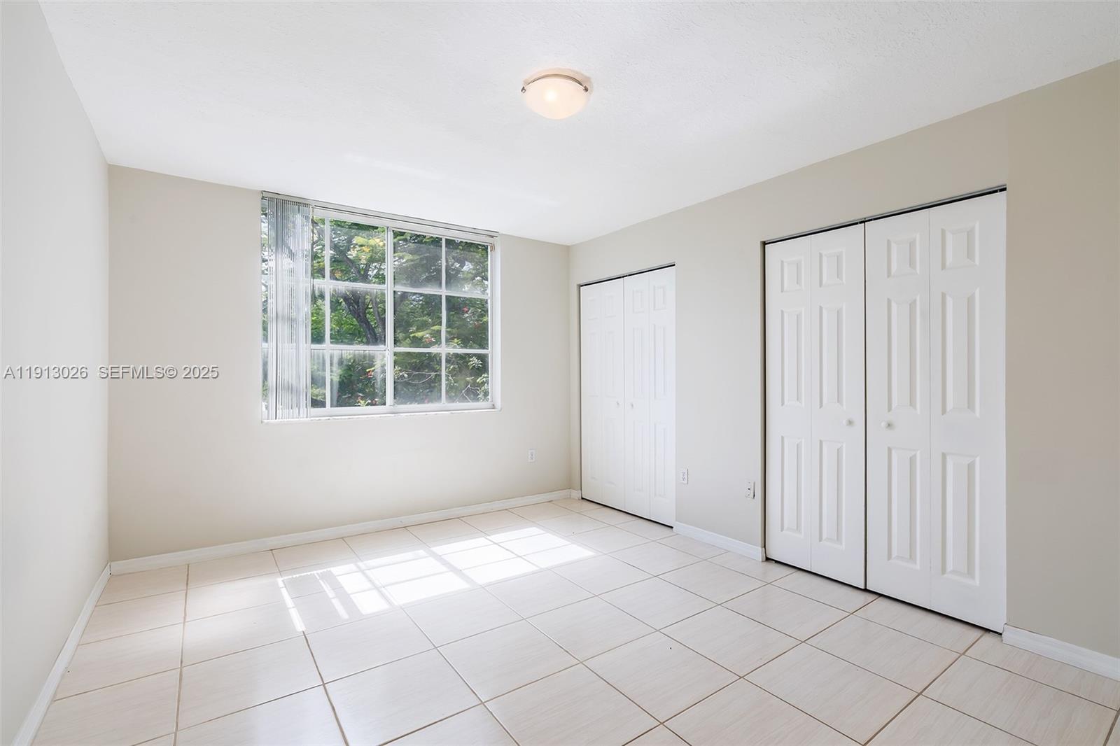 12136 St.Andrews Place, Unit 204 Miramar, FL 33025 - Photo 9 of 21 a view of an empty room with a window