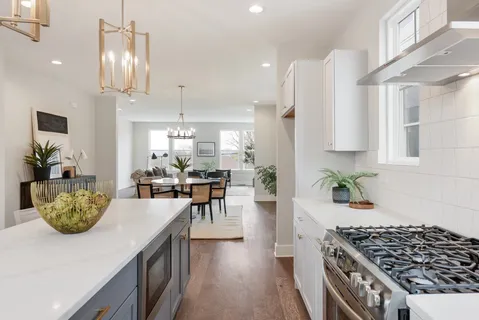 a kitchen with a table and chairs
