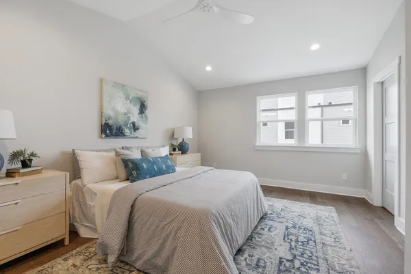 a bedroom with a large bed and a window