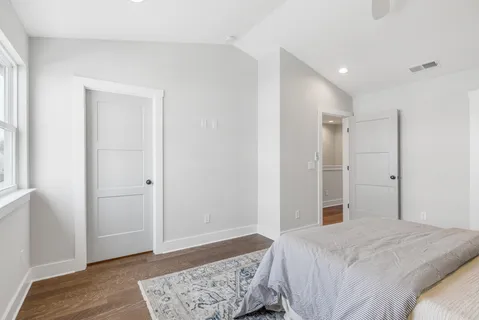 a bedroom with a bed and a dresser