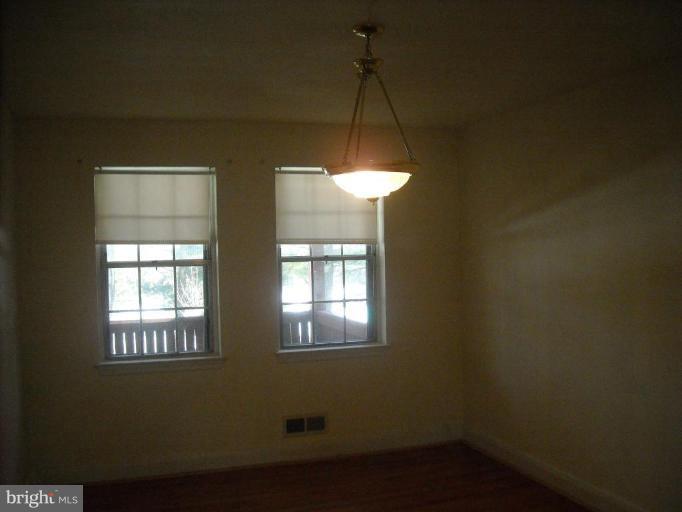 5741 Edgepark Road Baltimore, MD 21239 - Photo 2 of 16 a room that has a window in it