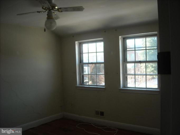 5741 Edgepark Road Baltimore, MD 21239 - Photo 11 of 16 an empty room with a window