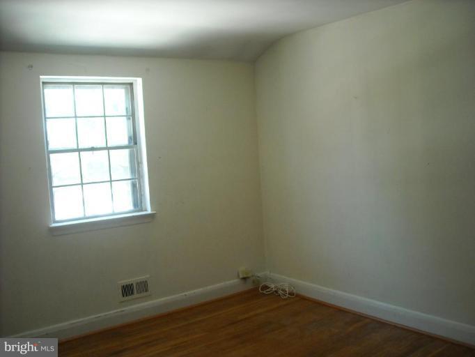 5741 Edgepark Road Baltimore, MD 21239 - Photo 12 of 16 an empty room with a window