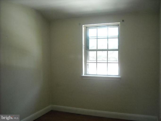 5741 Edgepark Road Baltimore, MD 21239 - Photo 4 of 16 an empty room with a window