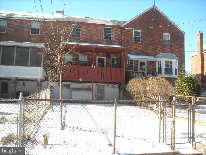 5741 Edgepark Road Baltimore, MD 21239 - Photo 7 of 16 a front view of a house with a yard