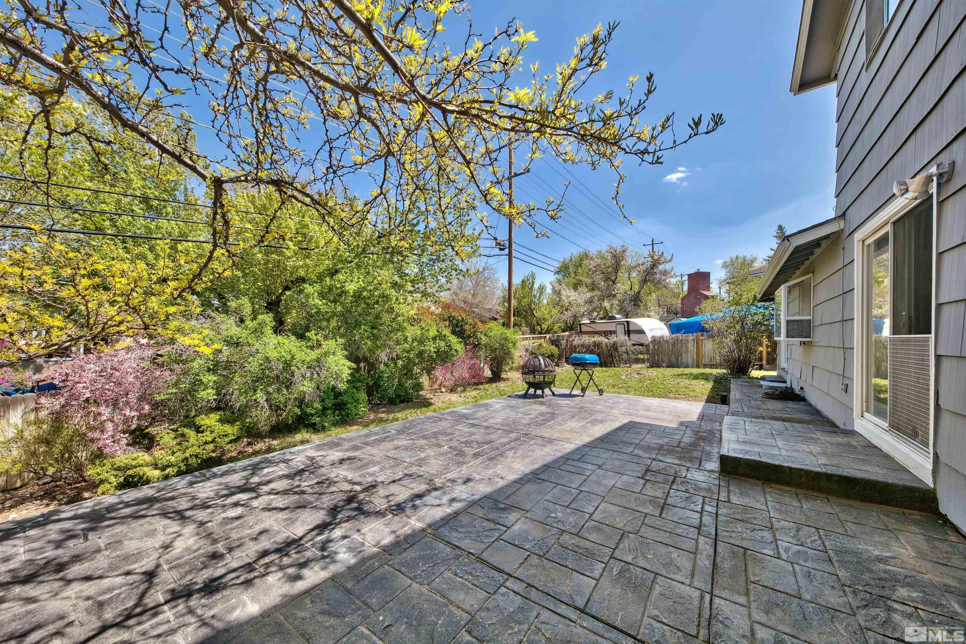 1070 Mark Allen Circle Reno, NV 89503 - Photo 3 of 11 a view of a chairs and table in a backyard