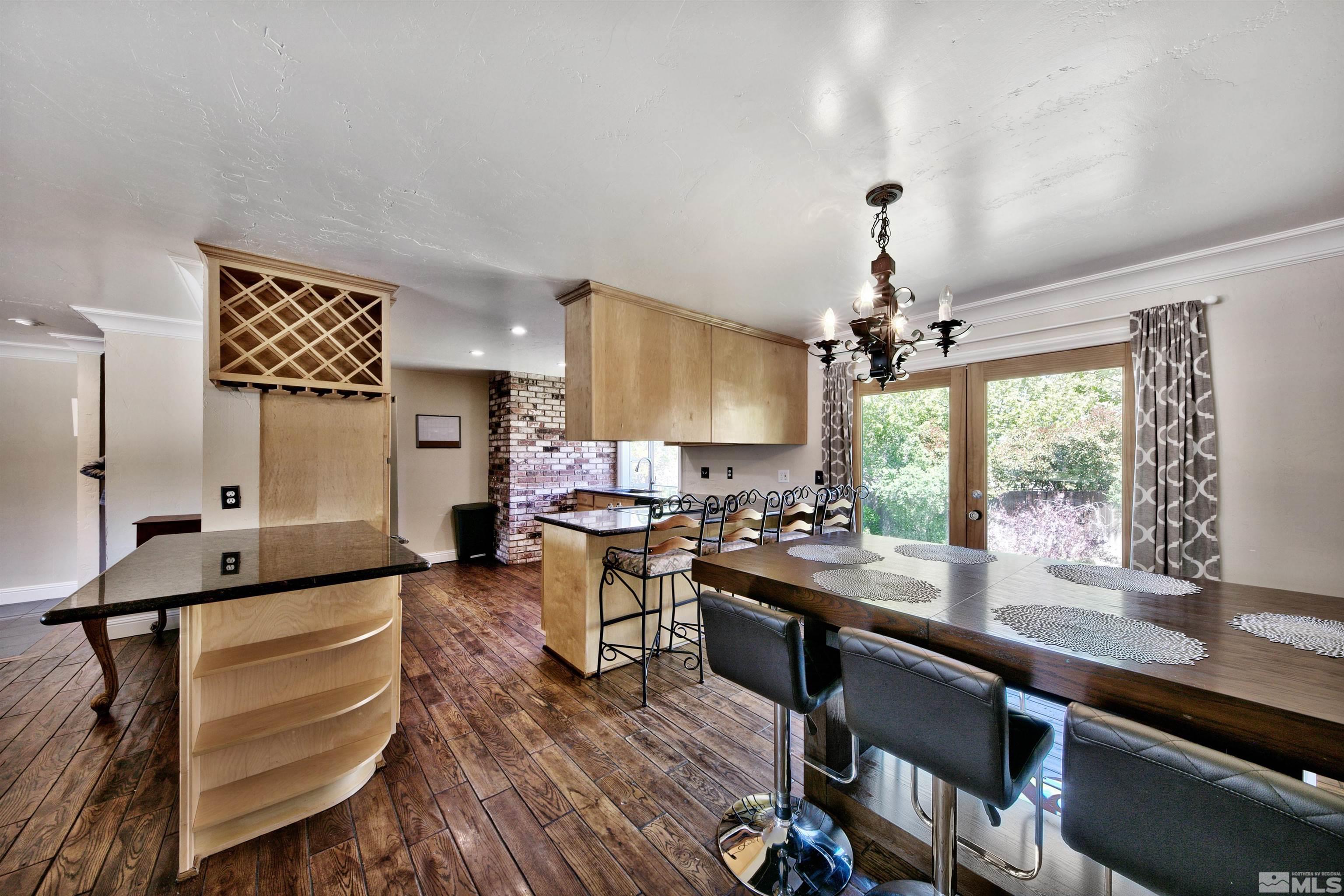 1070 Mark Allen Circle Reno, NV 89503 - Photo 5 of 11 a kitchen with sink cabinets and wooden floor