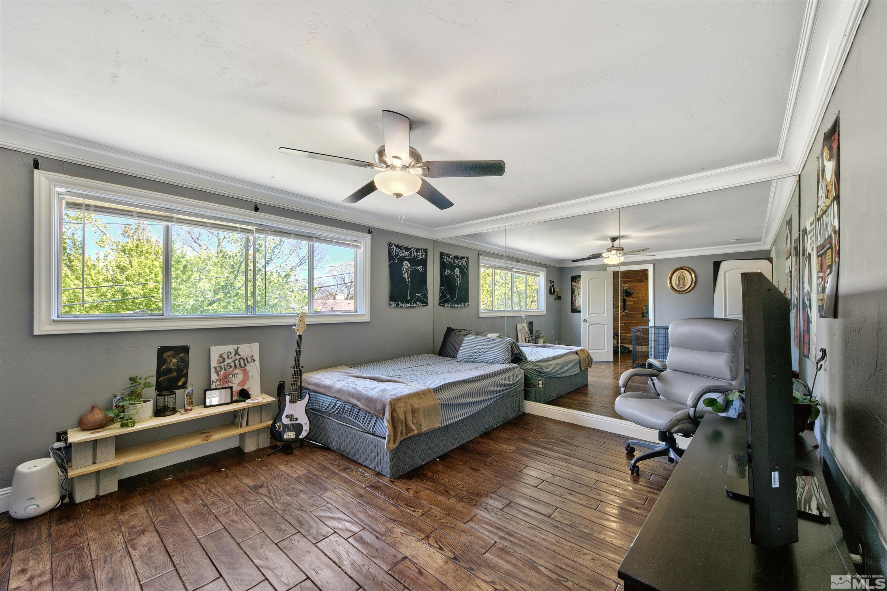1070 Mark Allen Circle Reno, NV 89503 - Photo 9 of 11 a bedroom with furniture and a wooden floor