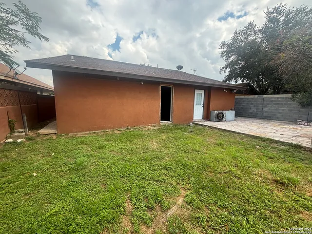 a backyard of a house with lots of green space