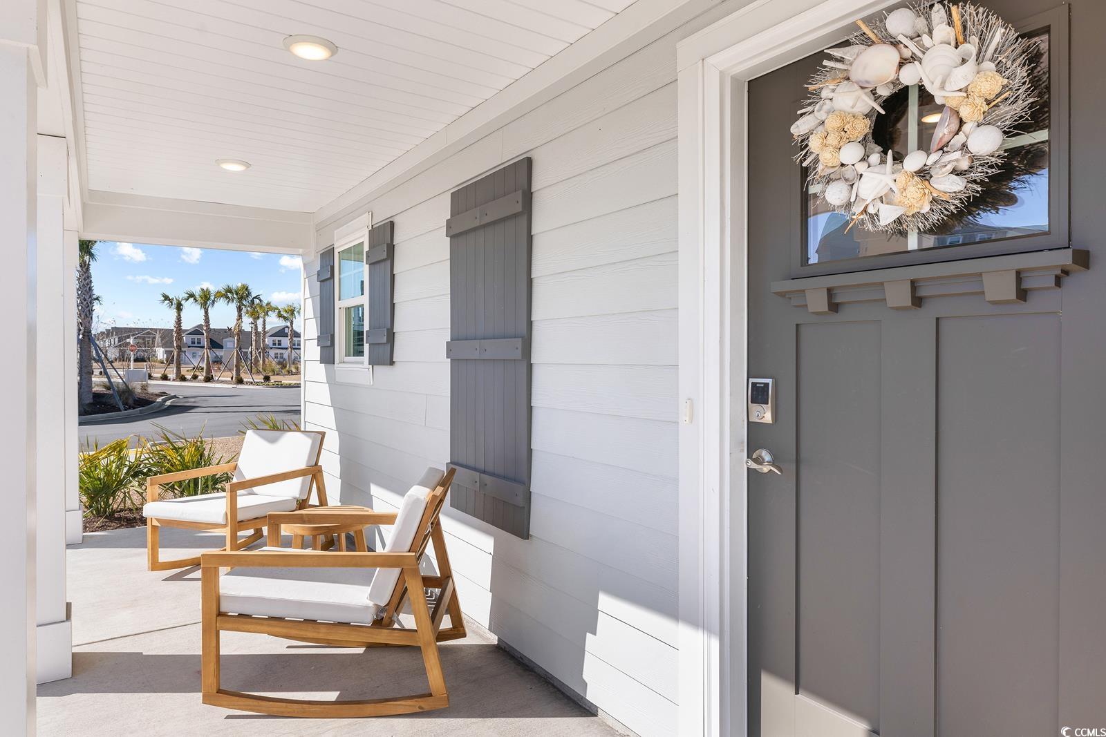 283 Ferretti Street, Unit CONCORD Myrtle Beach, SC 29579 - Photo 10 of 34 View of exterior entry with a porch