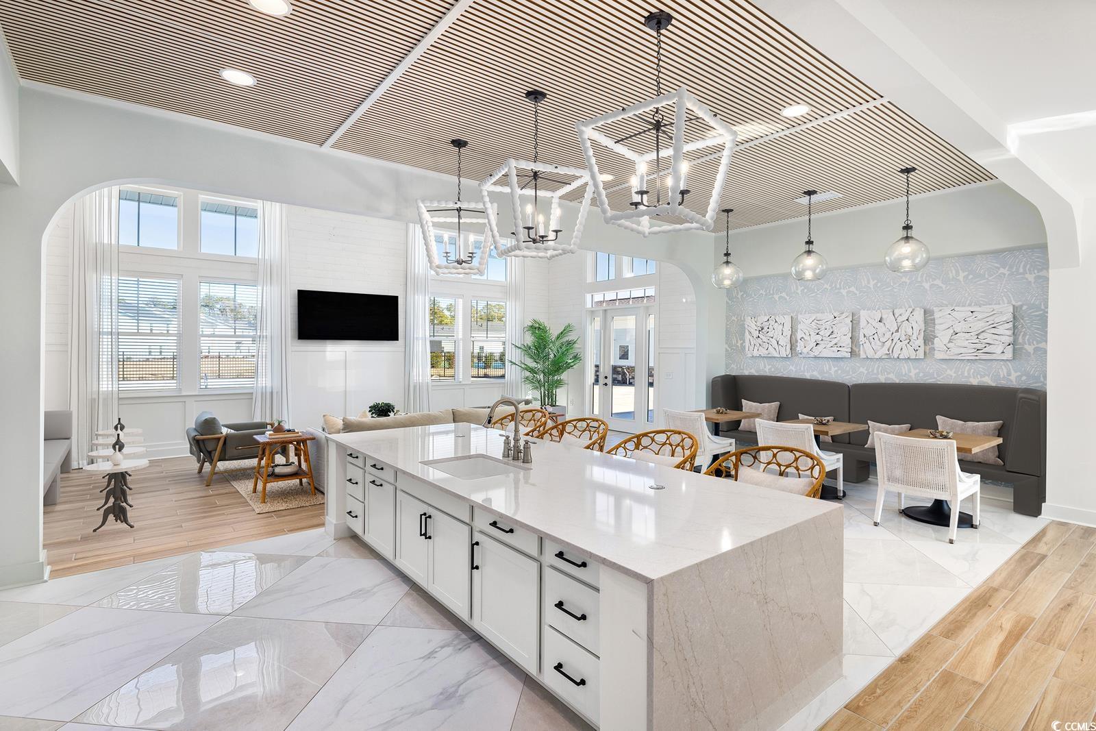 283 Ferretti Street, Unit CONCORD Myrtle Beach, SC 29579 - Photo 34 of 34 Kitchen with a sink, open floor plan, white cabinets, and pendant lighting