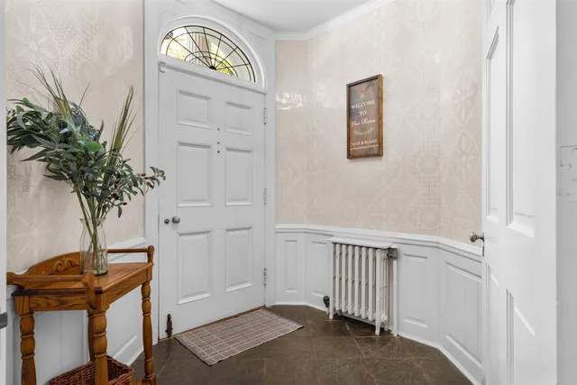 a view of staircase with white walls