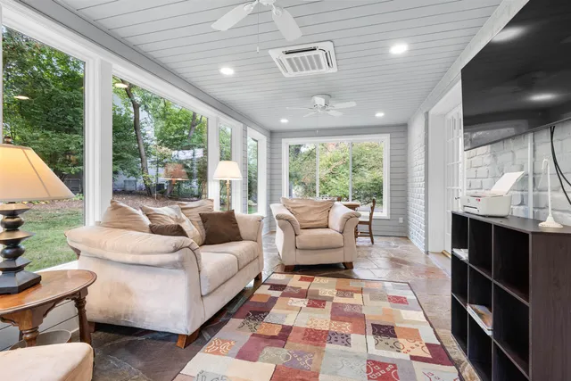 a bathroom with a shower a toilet and sink