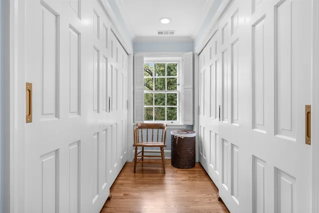 a kitchen with stainless steel appliances granite countertop a sink and a stove top oven with wooden floor