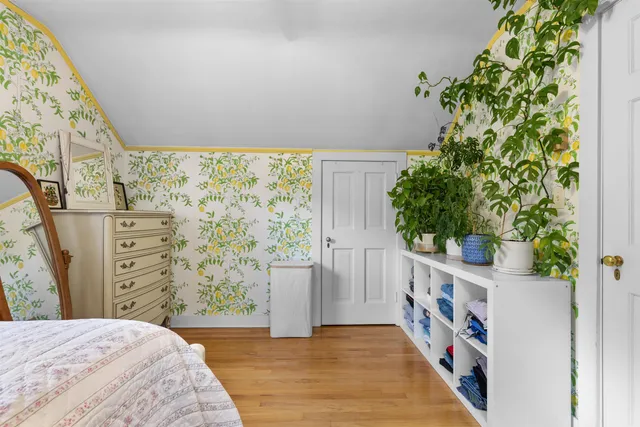 front view of a brick house with a yard