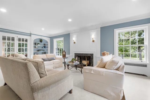 a living room filled with furniture window and wooden floor