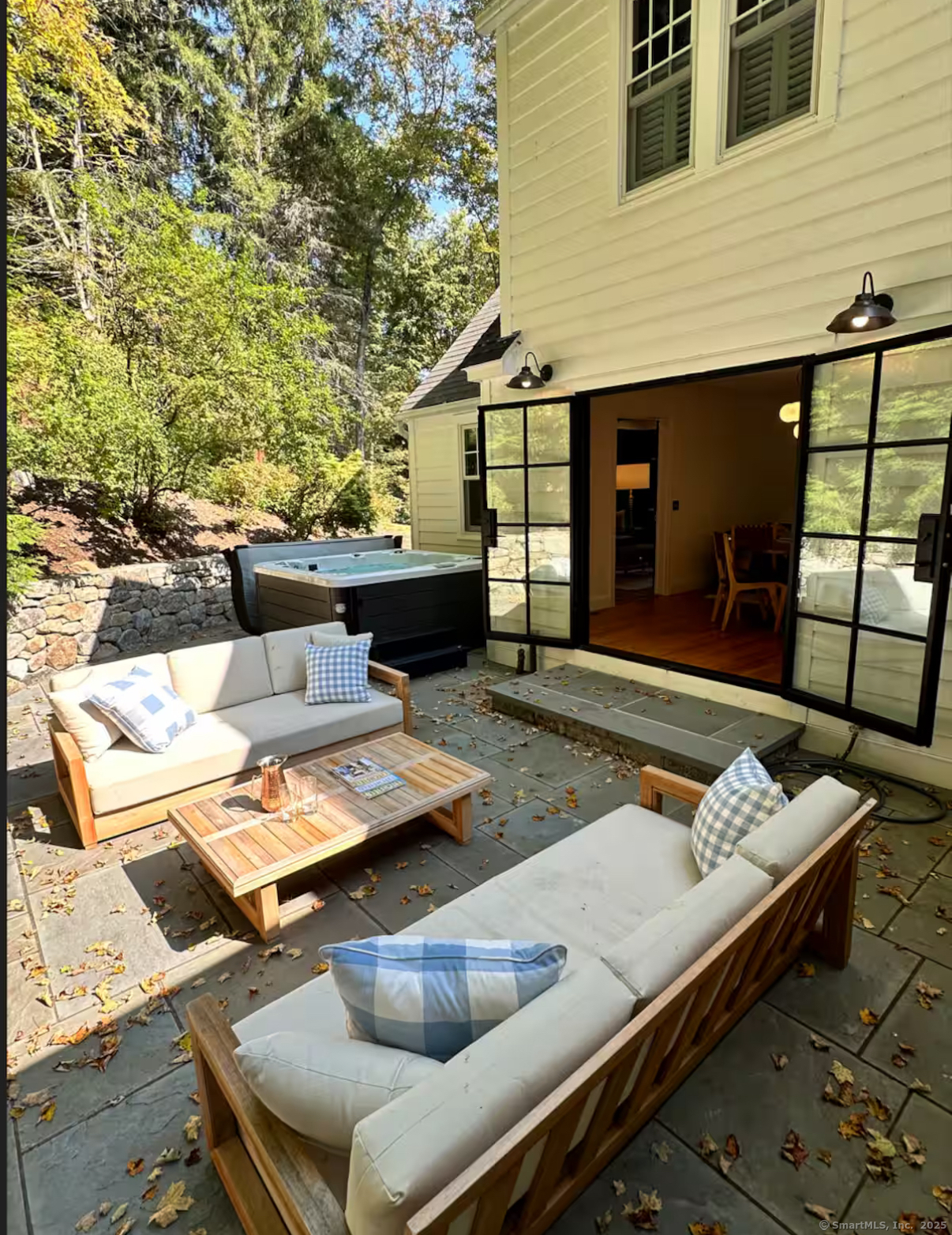 23 Cook Street Washington, CT 06794 - Photo 2 of 39 a view of a patio with couches table and chairs with wooden floor