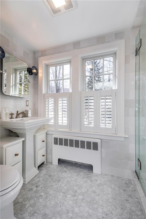 23 Cook Street Washington, CT 06794 - Photo 30 of 39 a bathroom with a granite countertop sink and a large mirror
