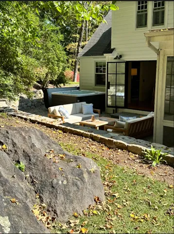 a backyard of a house with barbeque oven