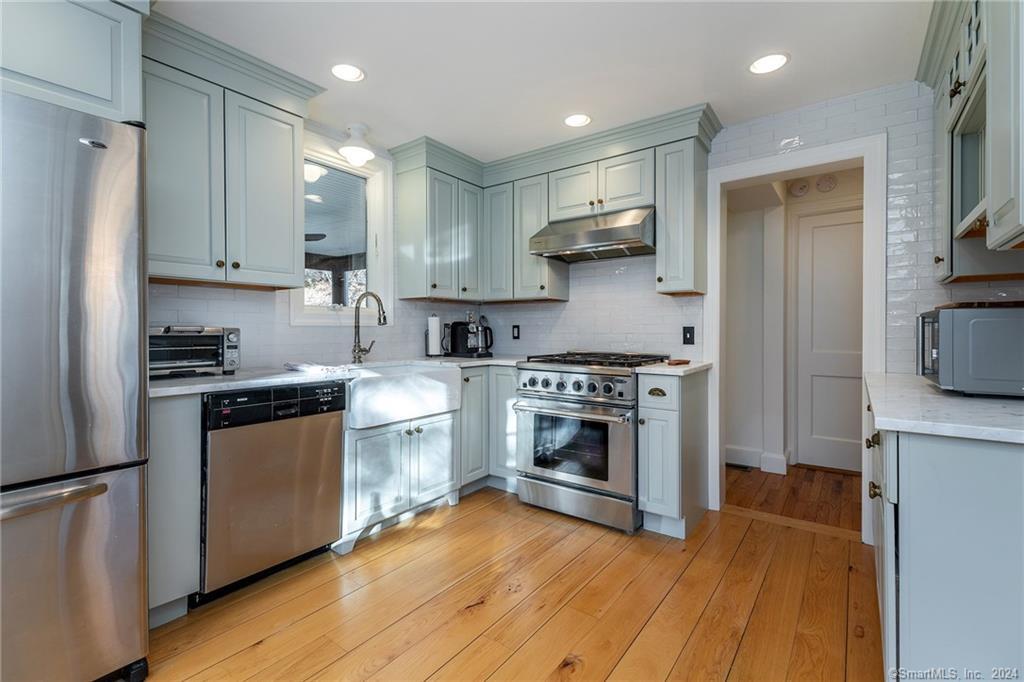 23 Cook Street Washington, CT 06794 - Photo 6 of 39 a kitchen with stainless steel appliances a stove a sink and a refrigerator